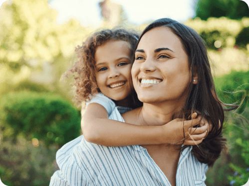 photo of smiling mother and daughter