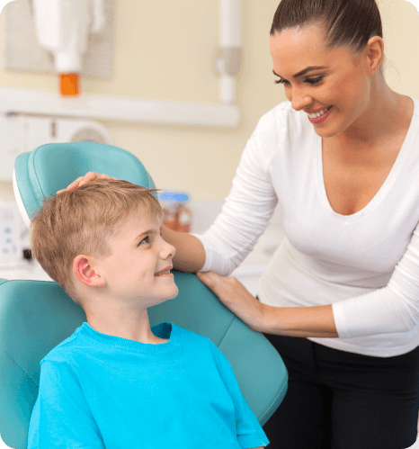 photo of smiling team member with child patient